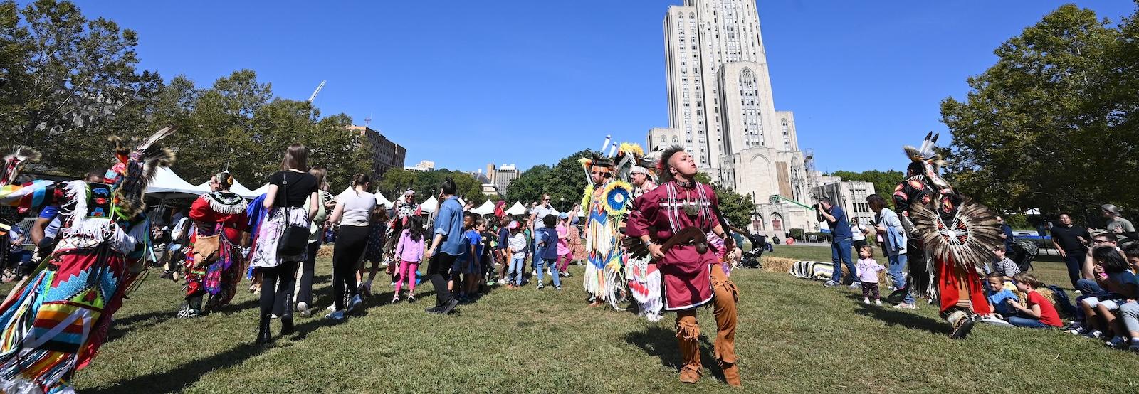 A photo of Native American dancers in Schenley Plaza